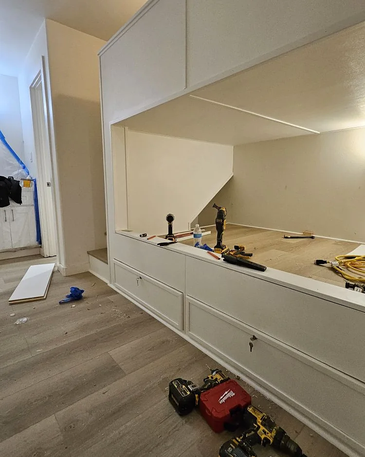 Custom built-in cabinetry and trim carpentry installed during an interior remodel