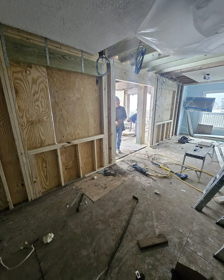 Wall sheathing and framing replaced during a beachfront interior renovation